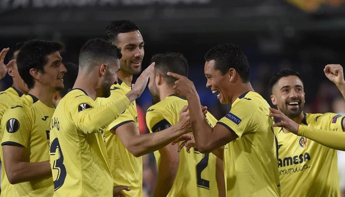 Villarreals Carlos Bacca (centre) is mobbed after scoring against Zenit in the round of 16. AFP