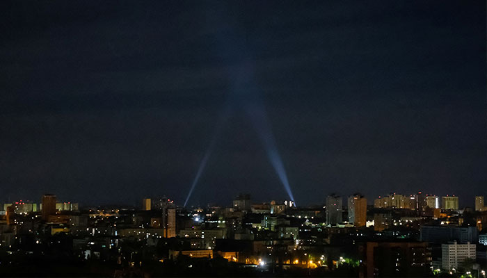 Ukrainian servicemen use searchlights as they search for drones in the sky over the city during a Russian drone strike, amid Russias attack on Ukraine, in Kyiv, Ukraine May 4, 2023. — Reuters