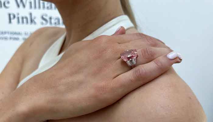 A model poses with a pink diamond due to put up for auction at Sothebys auction house in London, Britain August 31, 2022. — Reuters