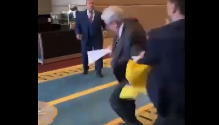 A Ukrainian delegate took umbrage when Russian counterpart snatched away his flag. Twitter