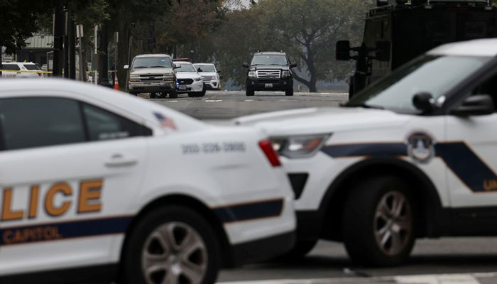 An SUV is seen as US Capitol Police vehicles block a street while investigating reports of a suspicious vehicle in front of the US Supreme Court in Washington, US. — Reuters/File