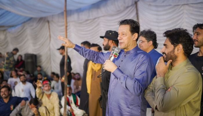 Pakistan Tehreek-e-Insaf (PTI) Chairman Imran Khan speaks with party workers at his residence in Zaman Park on April 20, 2023. —Facebook/ImranKhanOfficial