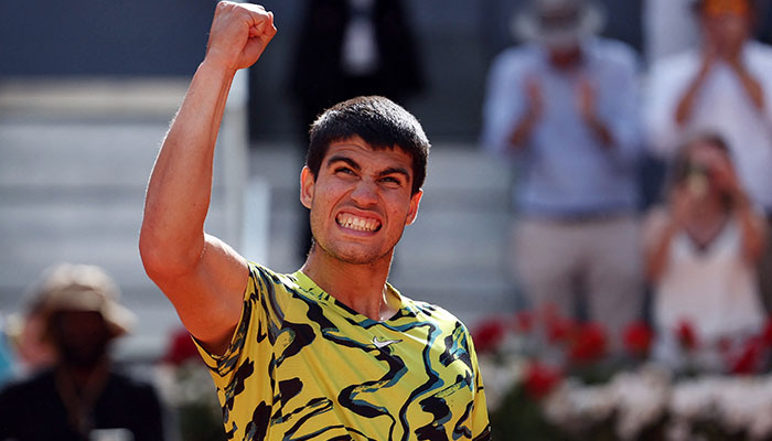 Spain´s Carlos Alcaraz celebrates beating Croatia´s Borna Coric during their 2023 ATP Tour Madrid Open tennis tournament singles semi-final match at Caja Magica in Madrid on May 5, 2023. AFP