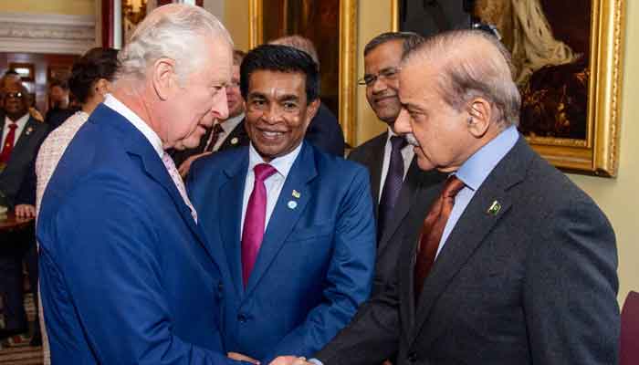 Prime Minister Shehbaz Sharif (right) greeting King Charles III. — Twitter/@GovtofPakistan