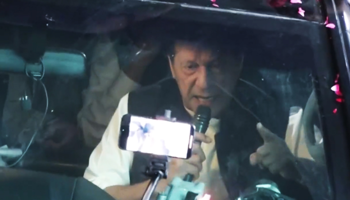 PTI Chairman Imran Khan addresses his supporters during a rally in Lahore, on May 6, 2023, in this still taken from a video. — Twitter/PTIOfficial