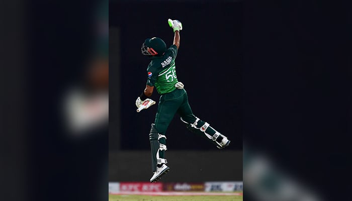 Pakistans captain Babar Azam celebrates after scoring a century during the fourth ODI between Pakistan and New Zealand at the National Stadium in Karachi on May 5, 2023. — AFP