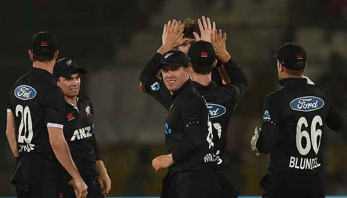 New Zealand players celebrate after dismissal of Pakistan´s Mohammad Rizwan (not pictured) during the fifth and final One-Day International (ODI) cricket match between Pakistan and New Zealand at the National Stadium in Karachi on May 7, 2023. — AFP