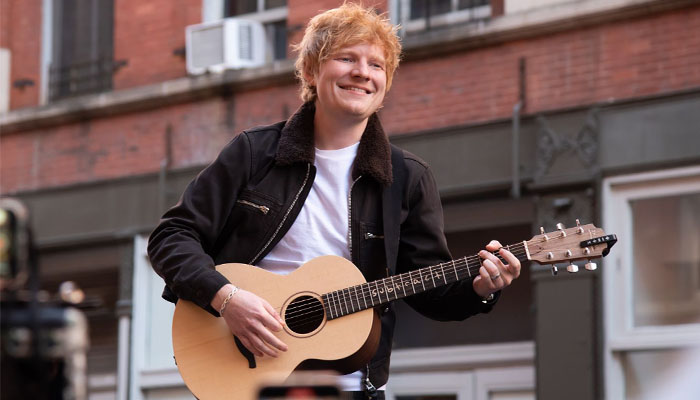 Ed Sheeran hops on a car for a spontaneous performance in NYC