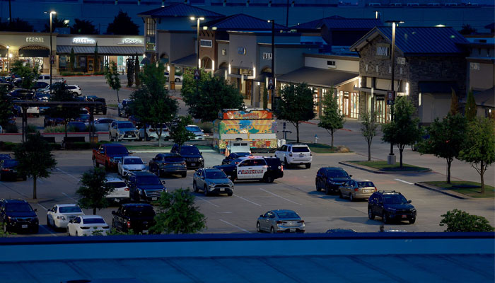 Cars are still in the parking lot of the Allen Premium Outlets mall on May 7, 2023, in Allen, Texas. — AFP