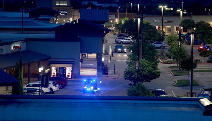 Cars are still in the parking lot of the Allen Premium Outlets mall. — AFP