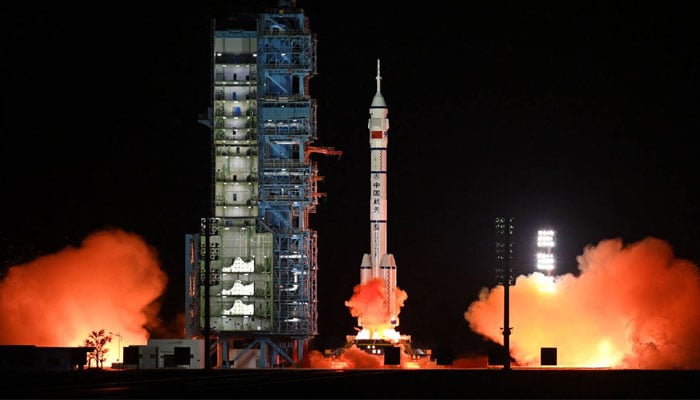 A Long March-2F rocket, carrying the Shenzhou-15 spacecraft with three astronauts to Chinas Tiangong space station, lifts off from the Jiuquan Satellite Launch Center in northwest Chinas Gansu province — AFP