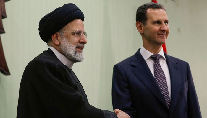 Syrias President Bashar al-Assad shakes hands with Iranian President Ebrahim Raisi during the signing of cooperation agreement in Damascus, Syria May 3, 2023. — Reuters