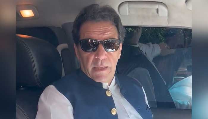 PTI Chairman Imran Khan speaks with journalists in Lahore before leaving for Islamabad to attend heraing of bail applications on May 9, 2023, in this still taken from a video. — Twitter/@PTIofficial