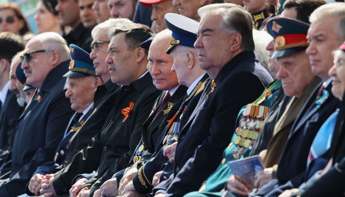 Russian President Vladimir Putin and guests attend the Victory Day military parade at Red Square in central Moscow on May 9, 2023. — AFP