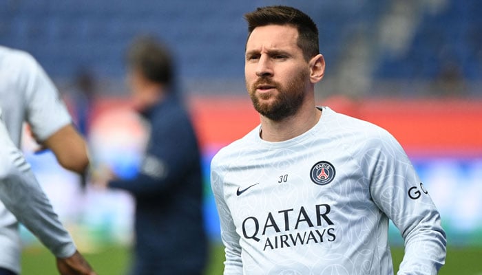This photo shows Paris Saint-Germains Argentine forward Lionel Messi looking on as he warms up prior to the French L1 football match between PSG and FC Lorient at The Parc des Princes Stadium in Paris on April 30, 2023. — AFP