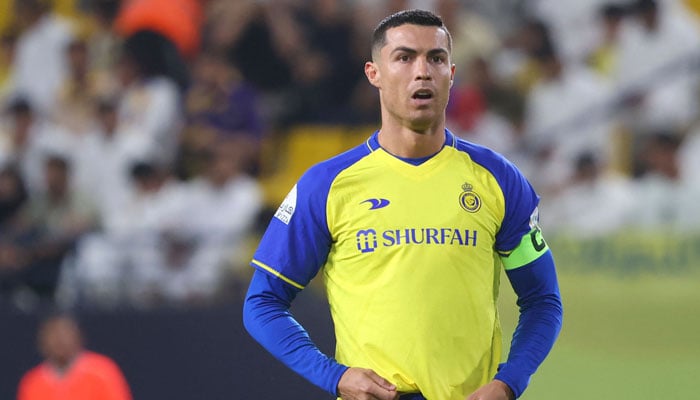 Cristiano, portugisisk angriber fra Nasr, ser Saudi Pro League-fodboldkampen mellem Al Nasr og Al Khaleej den 8. maj 2023 på Al Awal Park Stadium i Riyadh, Saudi-Arabien・Ronaldo. — AFP