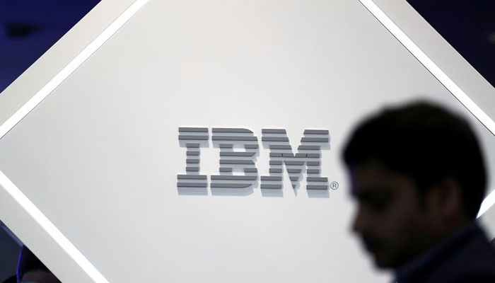 A man stands near an IBM logo at the Mobile World Congress in Barcelona, Spain. — Reuters/File