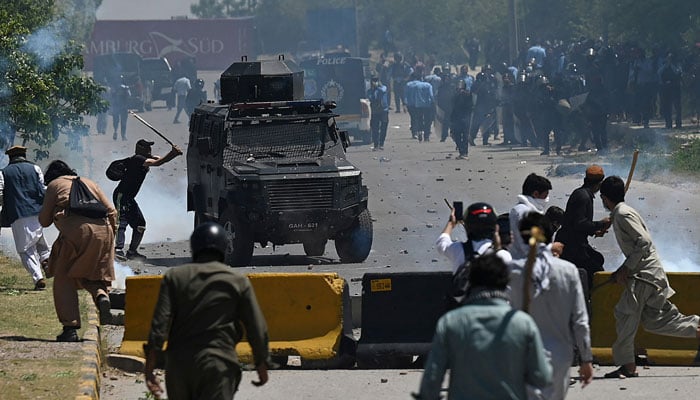 PTI party activists and supporters clash with police during a protest against the arrest of their leader, in Islamabad on May 10, 2023. — AFP