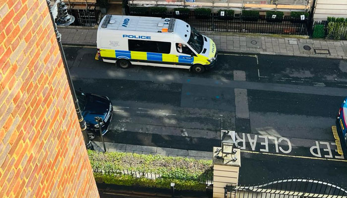 A police van parked outside  Avenfield House. — Provided by the author