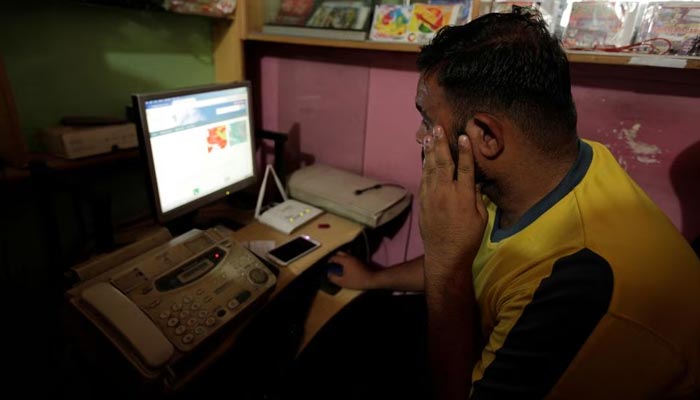 A man explores social media on a computer at an internet club in Islamabad, Pakistan, August 11, 2016. — Reuters