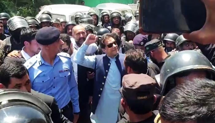 PTI Chairman Imran Khan waves at supporters as he appeared in Islamabad High Court, Islamabad, May 12, 2023. — Reuters