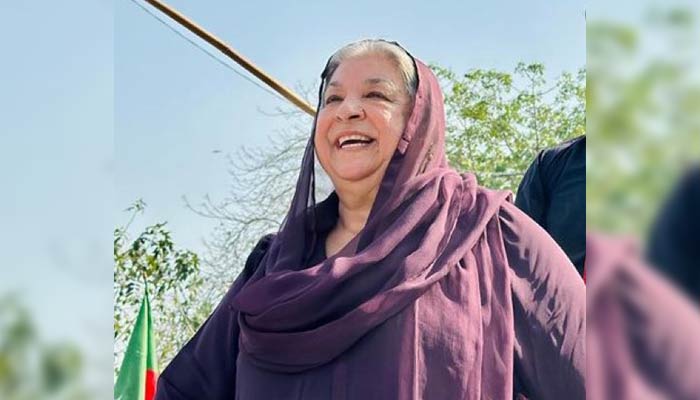 Dr Yasmin Rashid smiles during a PTI rally. — Twitter/PTIofficial