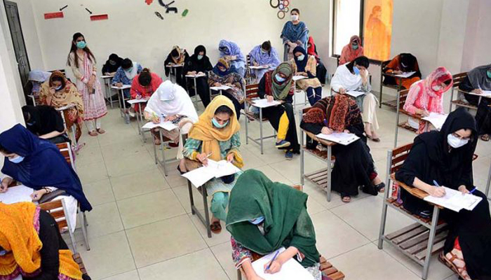 Students take exams at a center in Peshawar.  — APP/File