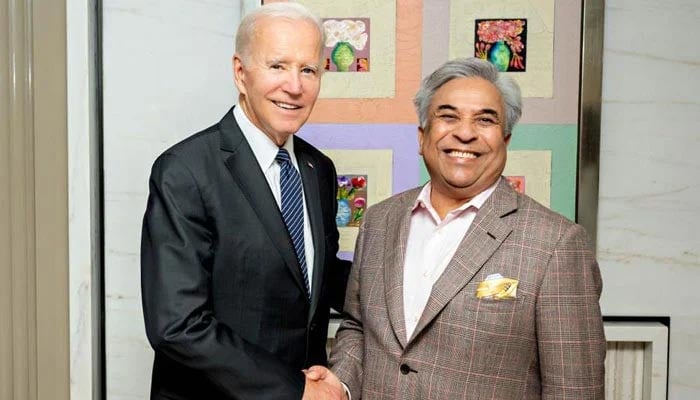 US President Joe Biden (L) shakes hands with Shahid Ahmed Khan, who has been appointed to the prestigious President's Advisory Committee on the Arts (PACA).  — Photo by author