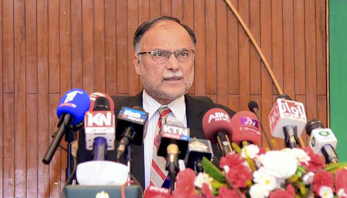 Minister of Planning, Development and Special Initiatives Ahsan Iqbal addresses a press conference in Islamabad on April 11, 2023. — APP