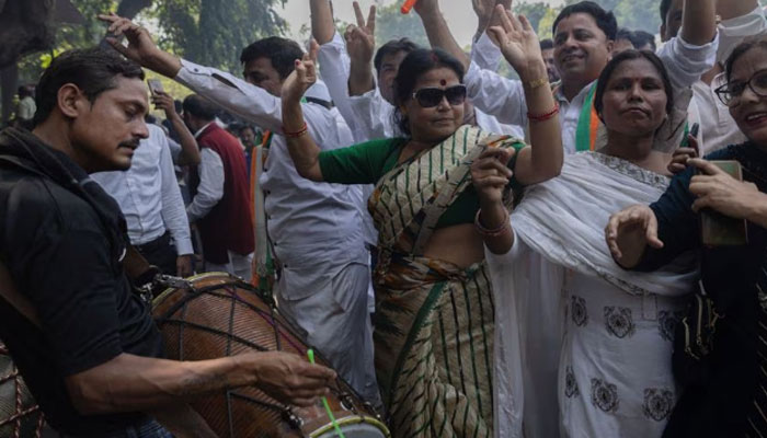 Supporters of the main opposition Congress party celebrate after the initial poll results in Karnataka elections at the party headquarters, in New Delhi, India, May 13, 2023. — Reuters