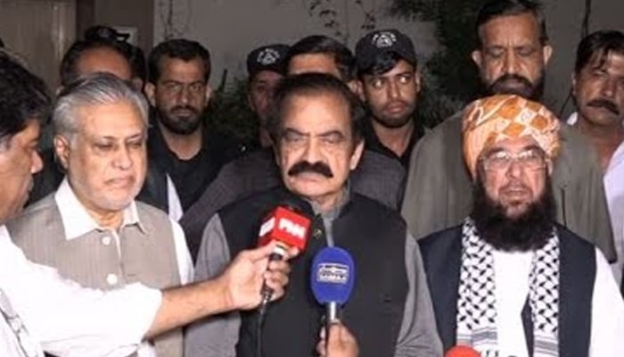 Interior Minister Rana Sanaullah along with PDM leaders speaking to the media after meeting Maulana Fazlur Rehman, in this screengrab taken on May 14, 2023. — GeoNews/YouTube