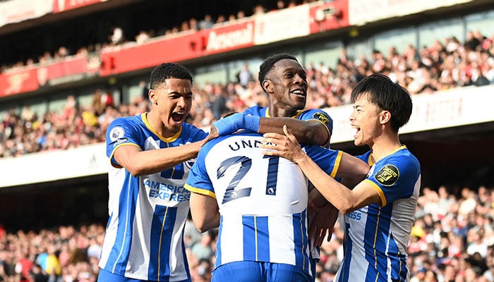 Brighton´s German striker Deniz Undav celebrates after scoring his teams second goal during the English Premier League football match between Arsenal and Brighton and Hove Albion at the Emirates Stadium in London on May 14, 2023.—AFP