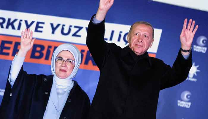 Turkish President Tayyip Erdogan, accompanied by his wife Emine Erdogan, greets supporters at the AK Party headquarters in Ankara, Turkey May 15, 2023. — Reuters