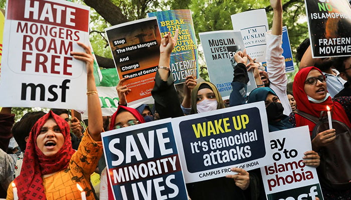 Citizens shout slogans and hold placards in New Delhi during a peace vigil organised by citizens against what they say is a rise in hate crimes and violence against Muslims in India, April 16, 2022. — Reuters