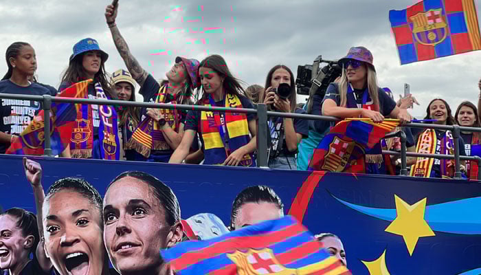 Barça womens team on an open-top bus for the victory parade. catalannews.com