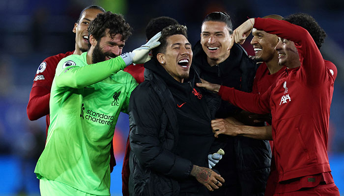 Liverpool´s Brazilian striker Roberto Firmino (C) celebrates with teammates at the end of the English Premier League football match between Leicester City and Liverpool at King Power Stadium in Leicester, central England on May 15, 2023. Liverpool wins 3 - 0 against Leicester City. AFP