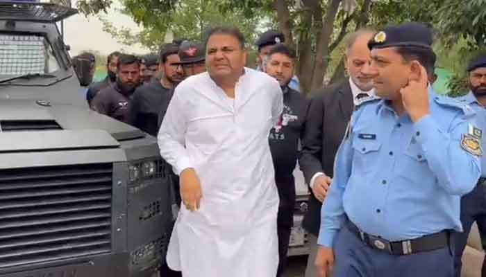 PTI Senior Vice President Fawad Chaudhry arrives at IHC under police custody. — Twitter/@PTIofficial