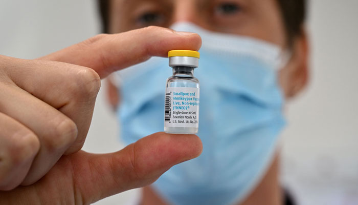 A doctor poses with a monkeypox vaccine vial in Montpellier, southern France on August 23, 2022. — AFP