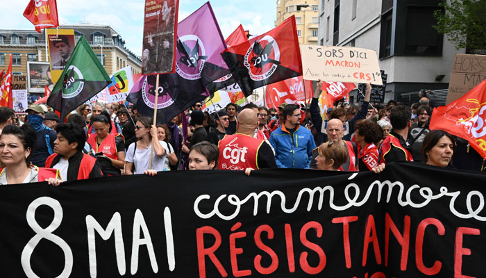 Protesters attend a demonstration against Frances pension reform, ahead of French President Emmanuel Macrons visit to attend a ceremony paying tribute to Resistance leader Jean Moulin, in Lyon, central-eastern France, on May 8, 2023. — AFP