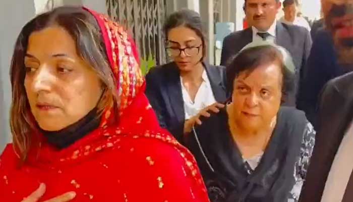 PTI Senator Falak Naz (left) and Senior Vice-President Dr Shireen Mazari leave the court premises after release on May 17, 2023, in this still taken from a video. — Twitter/siasatpk