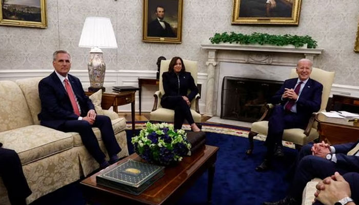 US President Joe Biden is flanked by Vice President Kamala Harris and Senate Majority Leader Chuck Schumer (D-NY) as he hosts debt limit talks with HSenate Minority Leader Mitch McConnell (R-KY), House Speaker Kevin McCarthy (R-CA), and Congressional leaders in the Oval Office at the White House in Washington, US, May 16, 2023. —Reuters