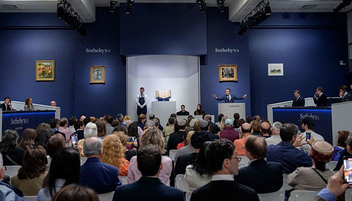 Sothebyâ€™s auctioneer Benjamin Doller (C R) takes bids during the Codex Sassoon sale at Sothebyâ€™s in New York City on May 17, 2023. —AFP