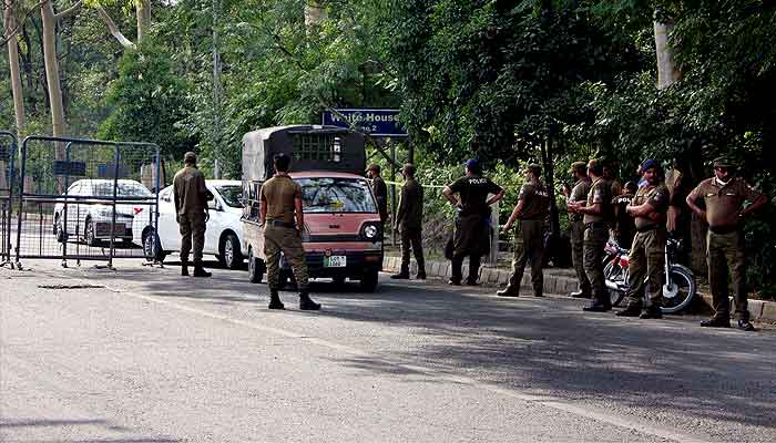 Police personnel are searching commuters at Sundar Das Road near Zaman Park in Lahore on Wednesday, May 17, 2023. —PPI