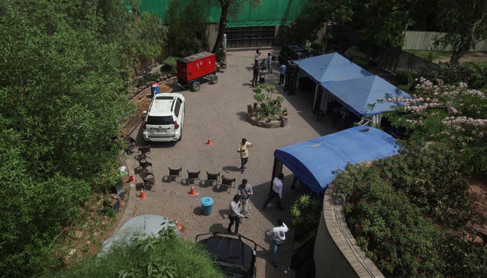 Members of the media, who were invited to visit, are seen at the premises of former prime minister Imran Khans house, after the government warned him to hand over supporters who it blamed for attacks on the army, in Lahore, May 18, 2023. — Reuters