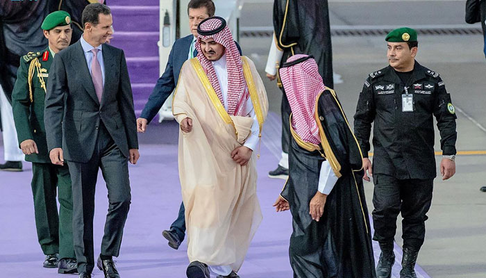 This picture shows Deputy Emir of Mecca Prince Badr bin Sultan bin Abdulaziz (C) welcoming Syrian President Bashar al-Assad (L) in Jeddah. — AFP