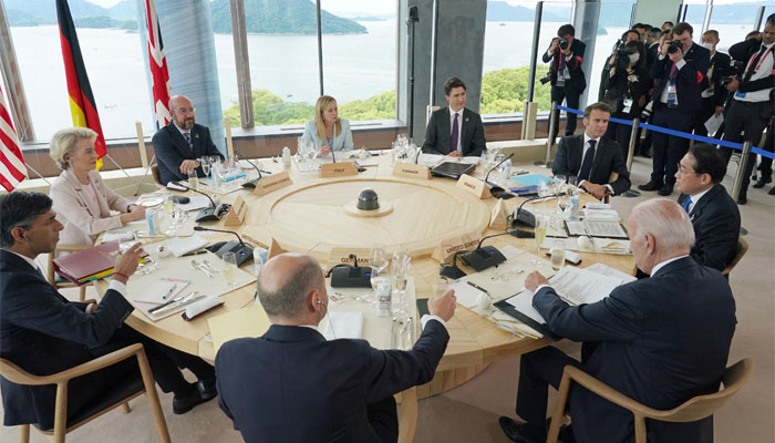 (Clockwise bottom L to R) Germanys Chancellor Olaf Scholz, Britains PM Sunak, EC President Ursula von der Leyen, European Council President Michel, Italys PM Meloni, Canadas PM Trudeau, Frances President Macron, Japans PM Kishida and US President Biden attend a working lunch meeting at the start of the G7 Summit. — AFP
