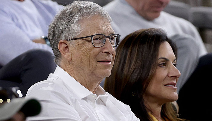 Bill Gates watches Elena Rybakina of Kazakhstan play Iga Swiatek of Poland during the semifinals of the BNP Paribas Open at the Indian Wells Tennis Garden on March 17, 2023, in Indian Wells, California. —AFP