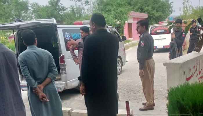 Police officials are present at the gas plant after the terror attack.