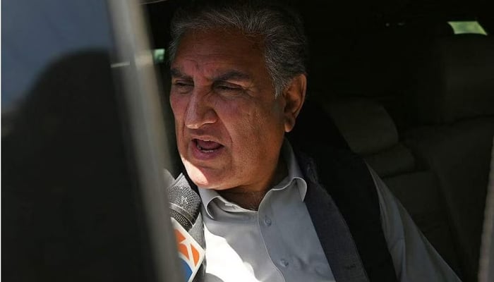 Shah Mahmood Qureshi, deputy head of PTI, speaks with the media in Islamabad on May 10, 2023. — AFP
