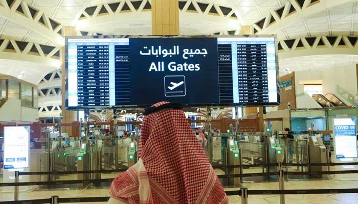 A Saudi man checks the flight timings at the King Khalid International Airport on May 16, 2021. — Reuters